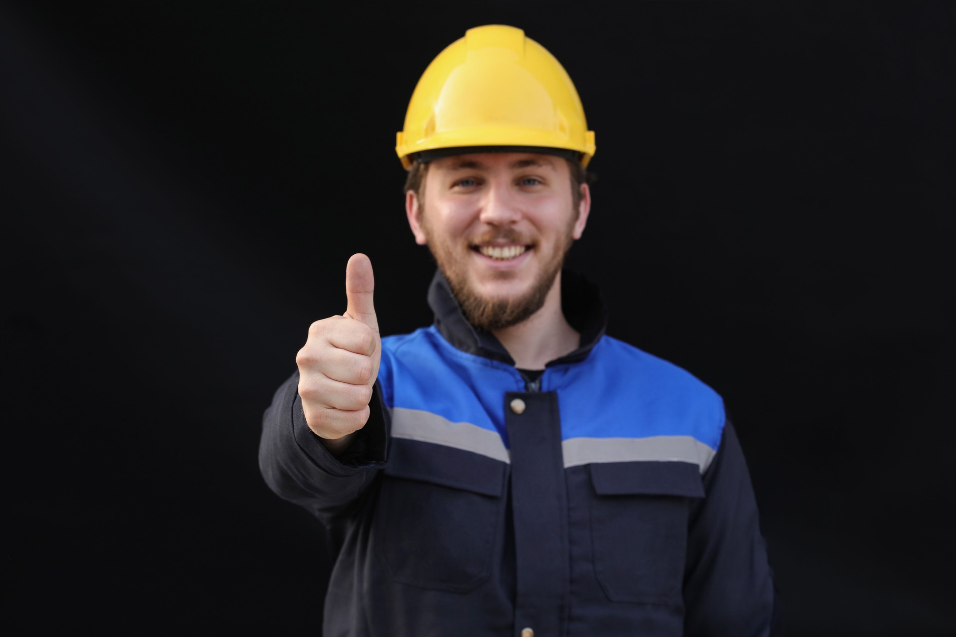 Construction worker with thumb up
